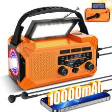 orange emergency radio with shining flashlight and illuminated solar panel