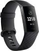 Fitbit band with digital screen showing the time